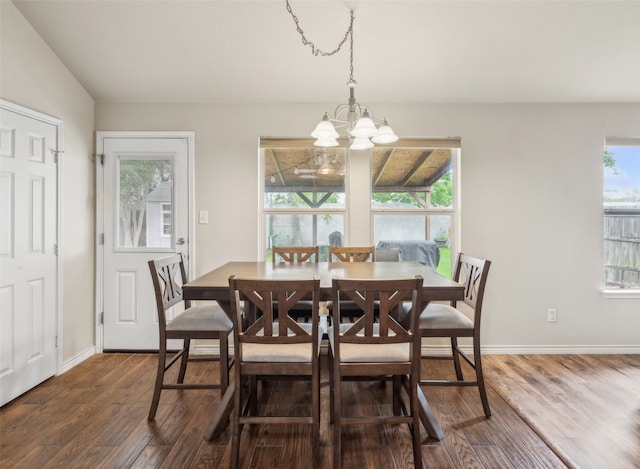dining room featuring baseboards, a notable chandelier, and dark wood-style floors