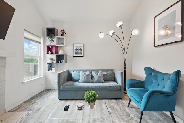 living room featuring baseboards and wood finished floors