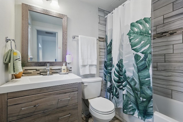 full bathroom featuring vanity, shower / bath combination with curtain, tasteful backsplash, toilet, and visible vents
