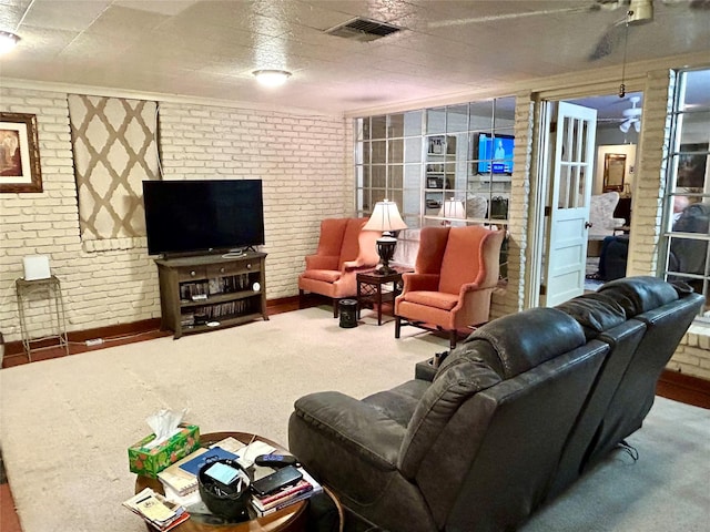 6114 Verona Ln, Shreveport, LA 71105 - carpeted living room featuring brick wall
