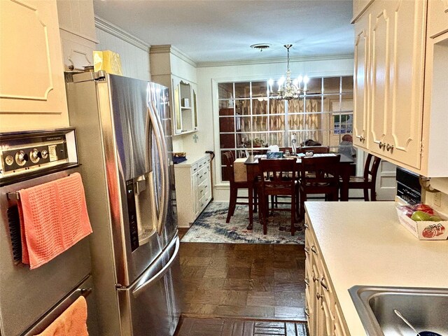 6114 Verona Ln, Shreveport, LA 71105 - kitchen with stainless steel refrigerator with ice dispenser, a chandelier, wall oven, crown molding, and decorative light fixtures