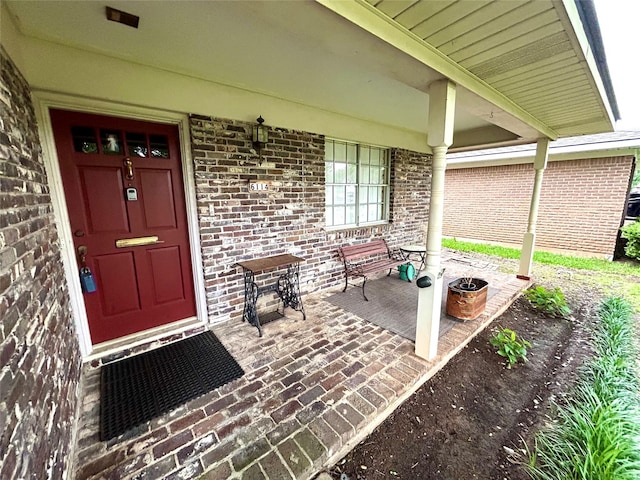 6114 Verona Ln, Shreveport, LA 71105 - doorway to property featuring covered porch and brick siding
