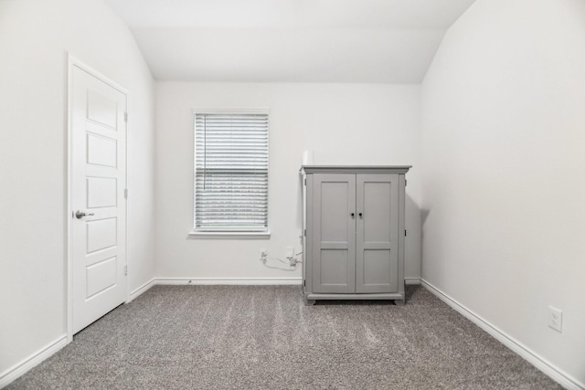 247 Carolina Trce, Fate, TX 75189 - carpeted spare room with vaulted ceiling and baseboards