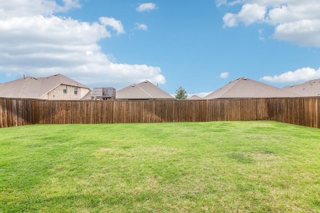 view of yard with a fenced backyard