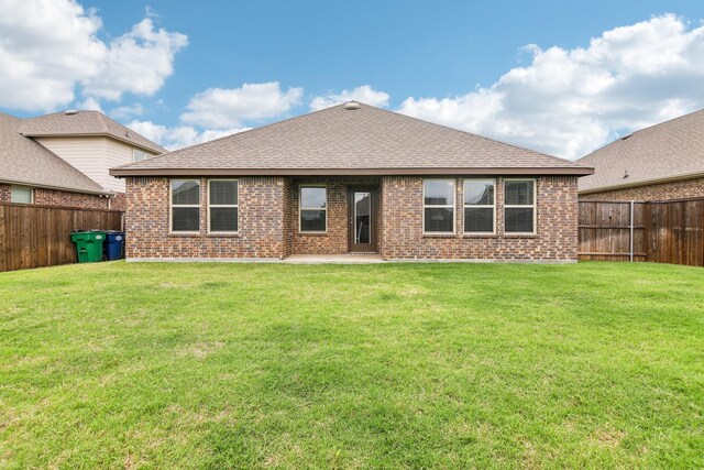 247 Carolina Trce, Fate, TX 75189 - rear view of property featuring brick siding, a shingled roof, and a patio