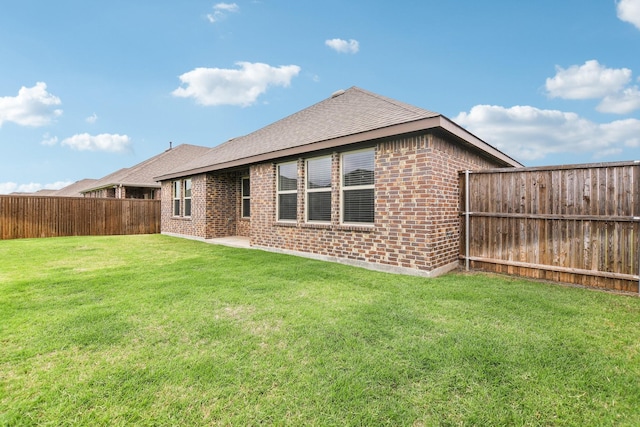 247 Carolina Trce, Fate, TX 75189 - back of property featuring brick siding and a shingled roof