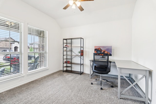 office featuring baseboards, a ceiling fan, vaulted ceiling, and carpet flooring