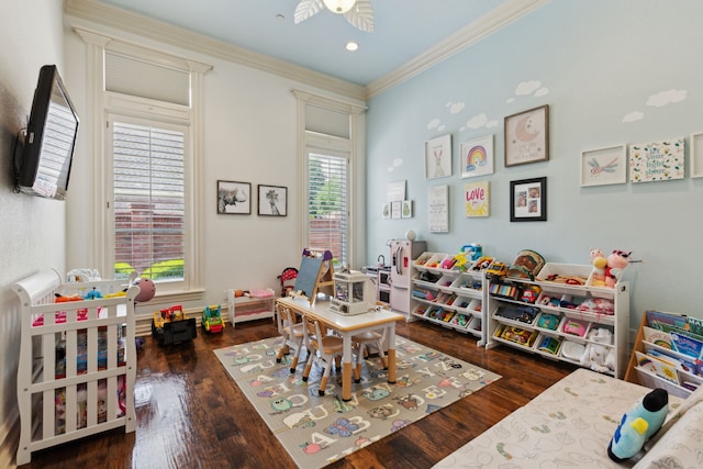 recreation room featuring crown molding and wood finished floors