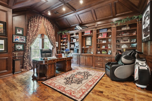 office with coffered ceiling, wood finished floors, recessed lighting, and a decorative wall