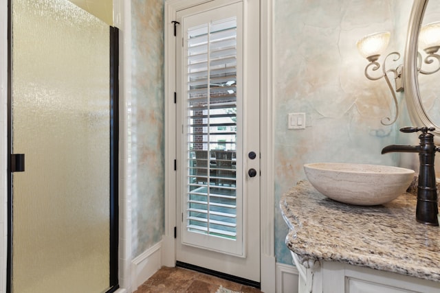 doorway to outside featuring a sink