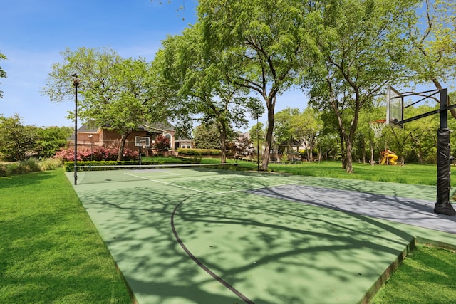 view of basketball court with a yard and community basketball court