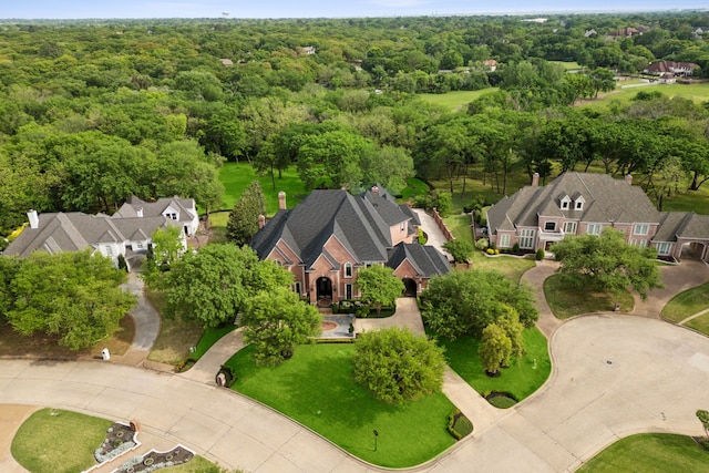 bird's eye view featuring a view of trees and a residential view