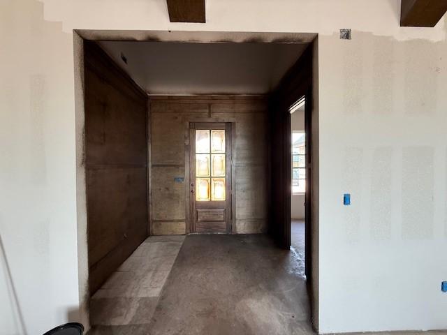 hallway featuring concrete flooring