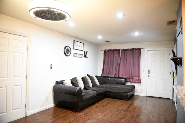 living area with recessed lighting, visible vents, baseboards, and dark wood-style floors