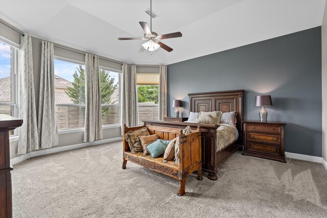 carpeted bedroom with baseboards, visible vents, and ceiling fan