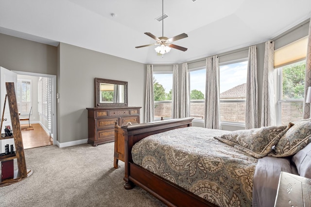 carpeted bedroom with baseboards, ceiling fan, and visible vents