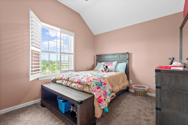 bedroom featuring carpet floors, baseboards, and vaulted ceiling