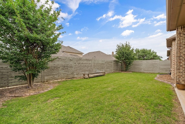 view of yard featuring a fenced backyard