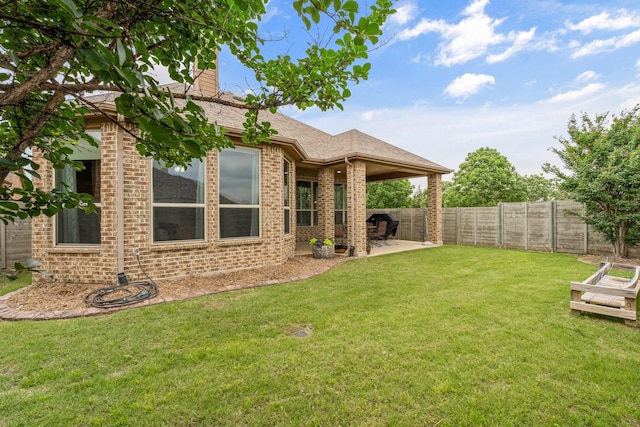 view of yard with a patio area and fence