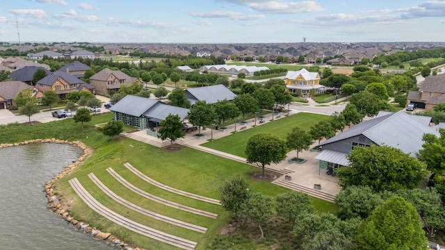 bird's eye view with a water view and a residential view