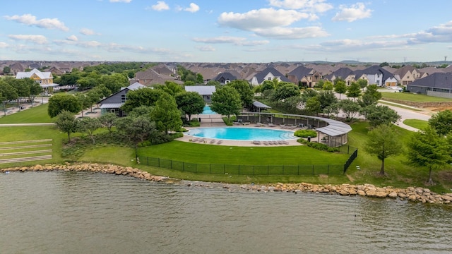 birds eye view of property featuring a water view and a residential view