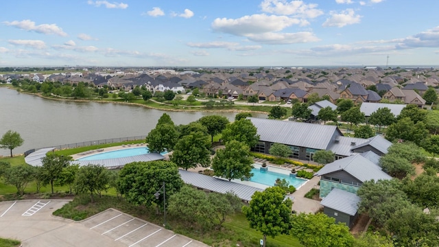 birds eye view of property featuring a water view and a residential view