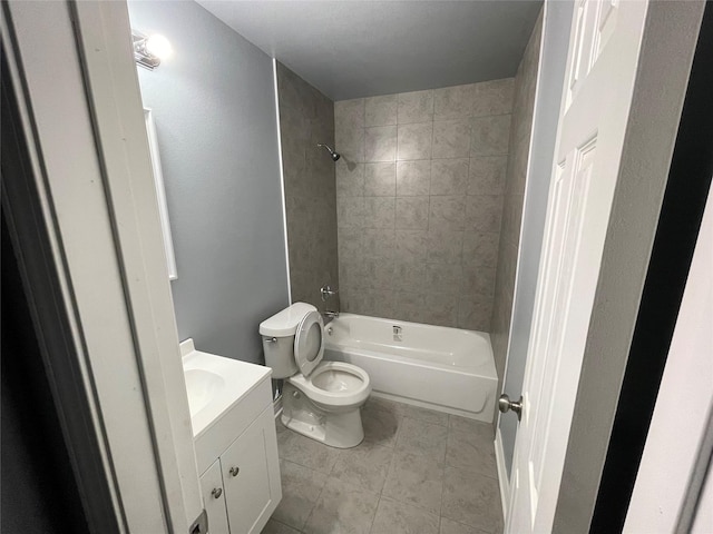 full bathroom featuring tile patterned floors, vanity, toilet, and bathing tub / shower combination