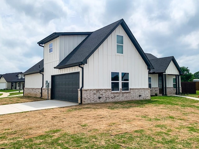 modern farmhouse with board and batten siding, brick siding, driveway, and a shingled roof
