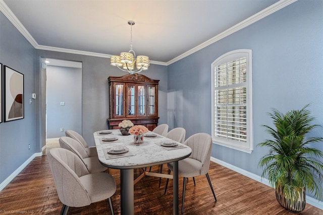 794 Amherst Dr, Rockwall, TX 75087 - dining area with a chandelier, wood finished floors, baseboards, and crown molding