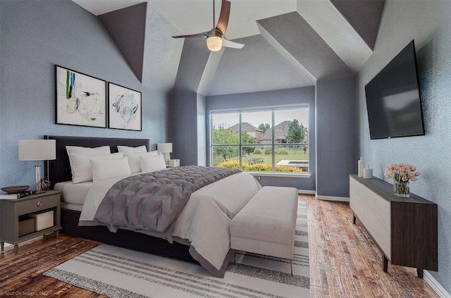 794 Amherst Dr, Rockwall, TX 75087 - bedroom with wood finished floors, baseboards, vaulted ceiling, and a ceiling fan