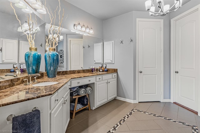 794 Amherst Dr, Rockwall, TX 75087 - full bath featuring a chandelier, tile patterned flooring, double vanity, and baseboards