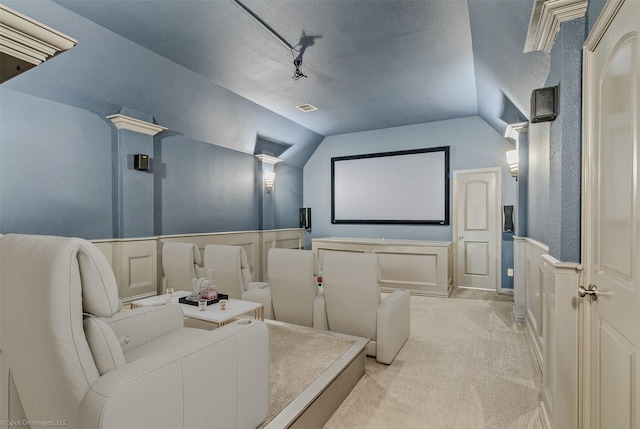 794 Amherst Dr, Rockwall, TX 75087 - cinema room featuring a decorative wall, light carpet, vaulted ceiling, a wainscoted wall, and track lighting