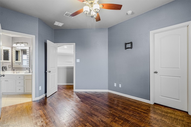 794 Amherst Dr, Rockwall, TX 75087 - unfurnished bedroom featuring light wood-type flooring, ensuite bath, a sink, and a ceiling fan