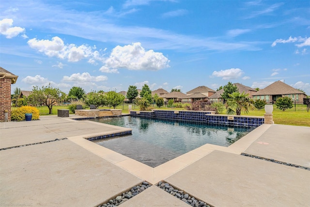 pool featuring a patio and fence