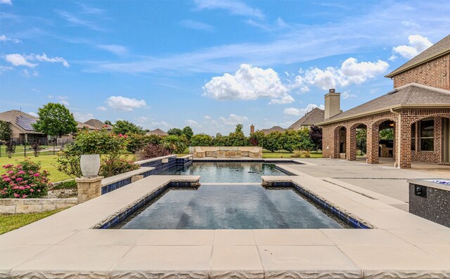 794 Amherst Dr, Rockwall, TX 75087 - view of swimming pool featuring a patio area and a pool with connected hot tub