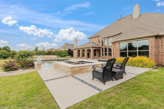 view of patio / terrace featuring an in ground hot tub and a gazebo