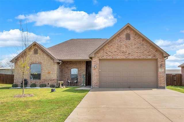 view of front of house featuring concrete driveway, a front yard, an attached garage, fence, and brick siding