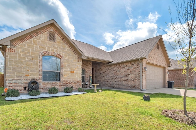 ranch-style house with a garage, brick siding, a front yard, and roof with shingles