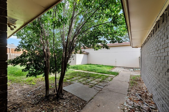 view of yard featuring a patio area and fence