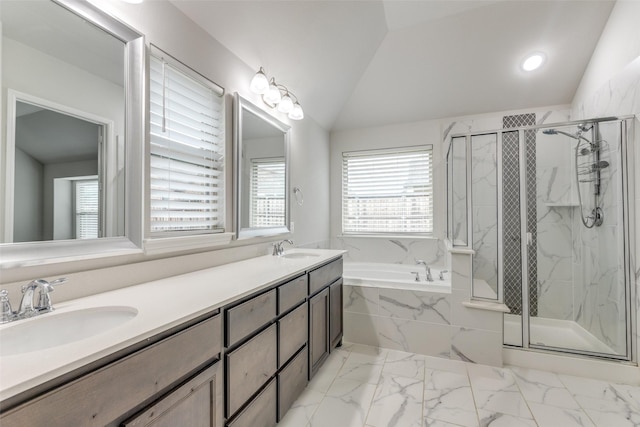 full bathroom featuring a sink, a marble finish shower, and lofted ceiling