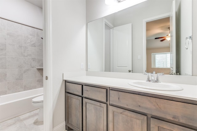 full bathroom featuring toilet, ceiling fan, shower / bathing tub combination, and vanity