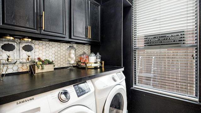 laundry area with cabinet space and independent washer and dryer