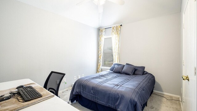 bedroom with baseboards, ceiling fan, and light carpet