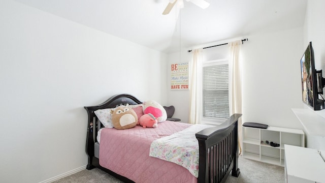 carpeted bedroom with baseboards and ceiling fan