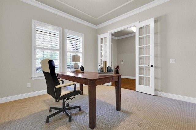 office area with crown molding, baseboards, light carpet, and french doors