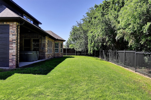 view of yard with a fenced backyard