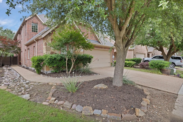 9405 National Pines Dr, Mckinney, TX 75072 - view of front facade featuring brick siding, an attached garage, and driveway