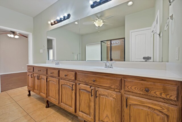 9405 National Pines Dr, Mckinney, TX 75072 - full bath with a ceiling fan, tile patterned floors, a sink, and a stall shower