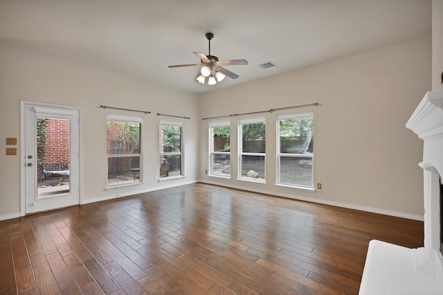 9405 National Pines Dr, Mckinney, TX 75072 - unfurnished living room featuring baseboards, ceiling fan, dark wood-type flooring, and visible vents