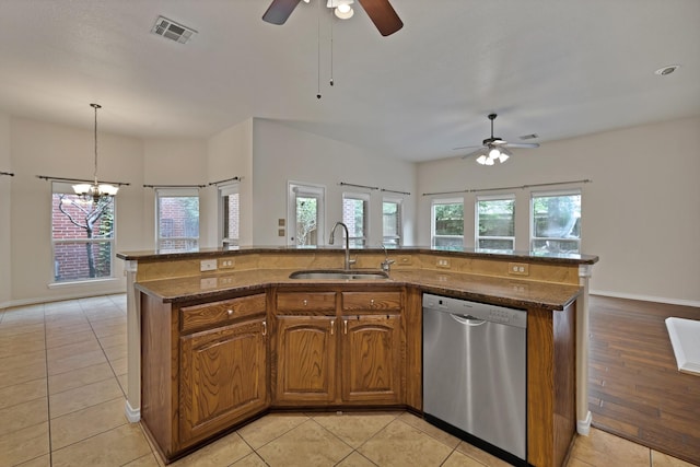 9405 National Pines Dr, Mckinney, TX 75072 - kitchen with stainless steel dishwasher, visible vents, brown cabinets, a sink, and ceiling fan with notable chandelier